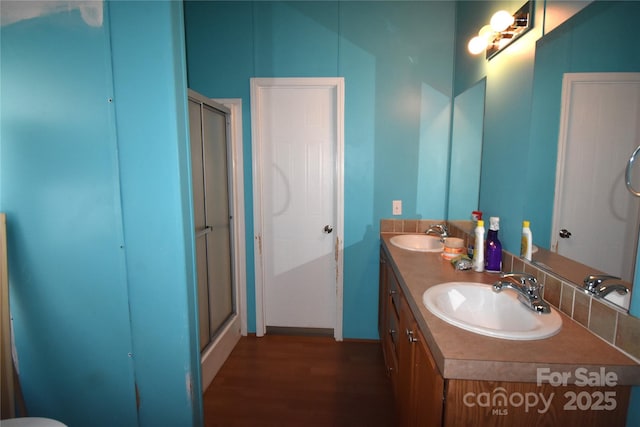 234 Olin Loop, Olin, NC 28660 - full bath with an enclosed shower, double vanity, and wood finished floors