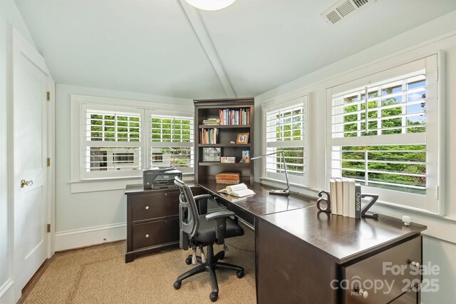office area featuring visible vents, vaulted ceiling with beams, and baseboards