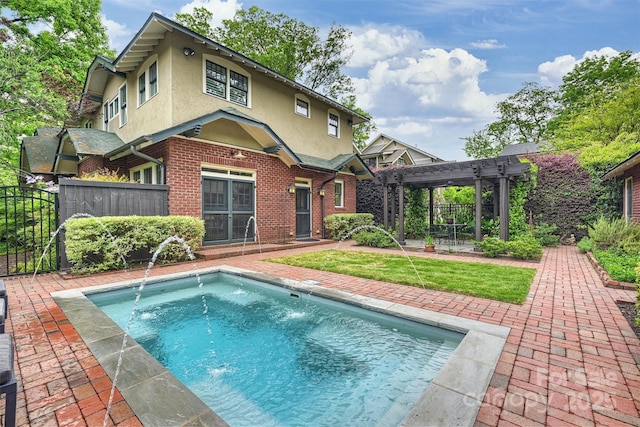 back of house featuring stucco siding, a pergola, fence, and a patio