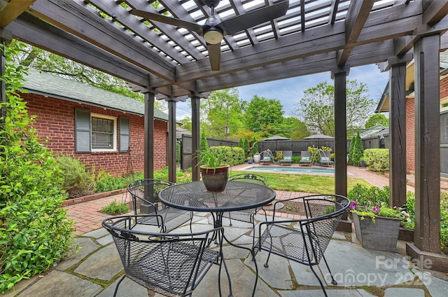 view of patio with a fenced backyard, a pergola, a fenced in pool, and outdoor dining area