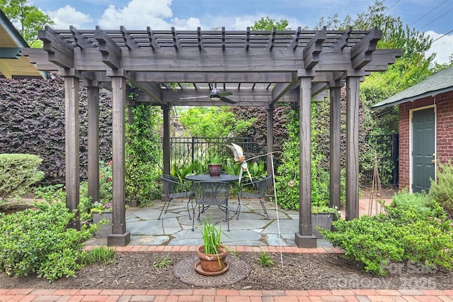 view of patio / terrace with fence and a pergola