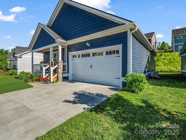 231 Leyland Cir, Hendersonville, NC 28792 - view of front facade with an attached garage, covered porch, concrete driveway, a front yard, and central air condition unit