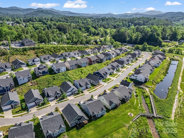 231 Leyland Cir, Hendersonville, NC 28792 - aerial view of property's location with a heavily wooded area, nearby suburban area, and a water and mountain view