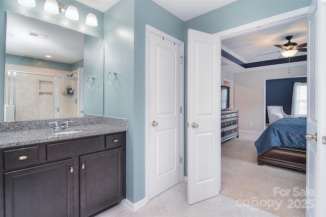 2014 Burton Point Ct, Waxhaw, NC 28173 - ensuite bathroom with vanity, a tile shower, a ceiling fan, tile patterned flooring, and ornamental molding
