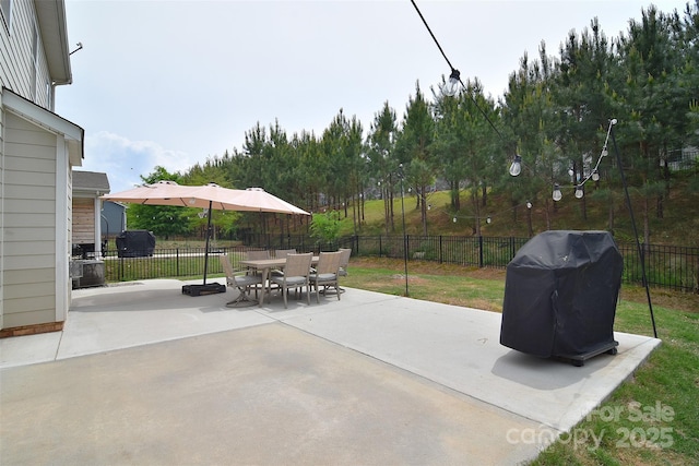2014 Burton Point Ct, Waxhaw, NC 28173 - fenced backyard featuring grilling area, a patio, and outdoor dining area