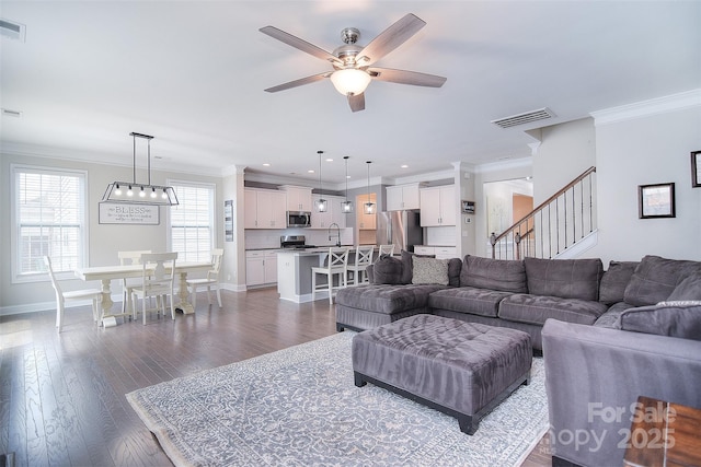 2014 Burton Point Ct, Waxhaw, NC 28173 - living room with a ceiling fan, ornamental molding, stairs, dark wood-type flooring, and recessed lighting