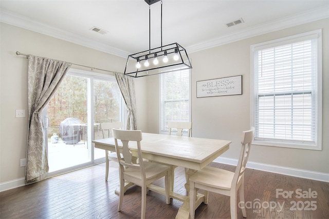2014 Burton Point Ct, Waxhaw, NC 28173 - dining space featuring crown molding, a chandelier, and wood finished floors