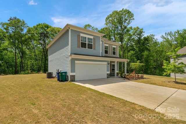 view of front of property with a front lawn, driveway, stone siding, an attached garage, and cooling unit