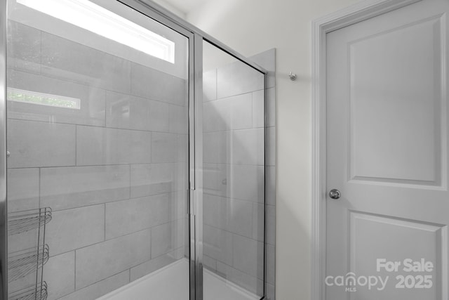 bathroom with a shower stall