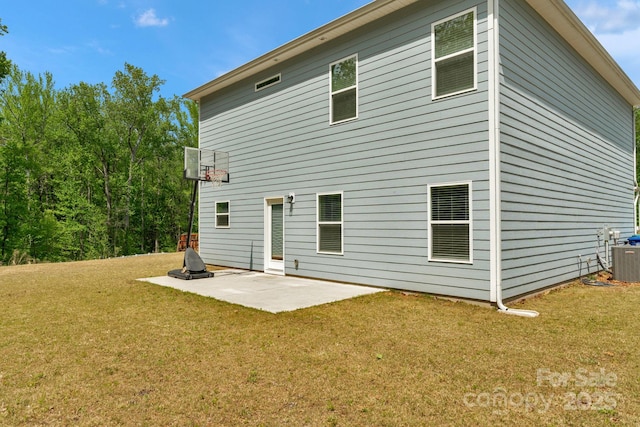 back of property featuring a yard, central air condition unit, and a patio area