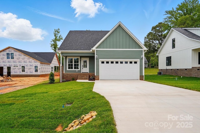 424 Fulton Dr, Kings Mountain, NC 28086 - craftsman-style home featuring board and batten siding, driveway, a front lawn, and a garage