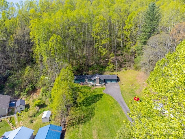 aerial view with a wooded view