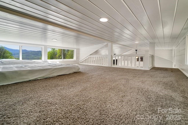 bonus room with recessed lighting, carpet, and a mountain view