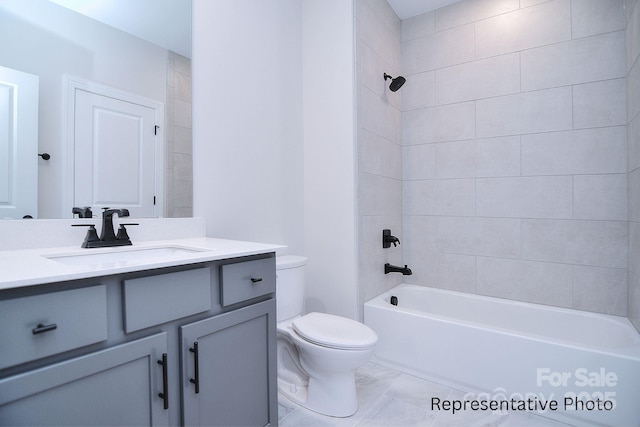 bathroom featuring vanity, shower / bathtub combination, and toilet