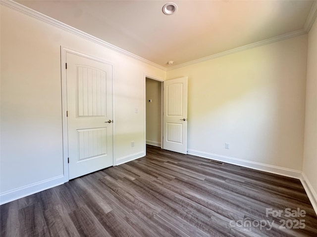 159 Hallman St, Cherryville, NC 28021 - unfurnished bedroom with dark wood finished floors, baseboards, and ornamental molding