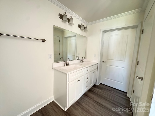 159 Hallman St, Cherryville, NC 28021 - bathroom featuring wood finished floors, double vanity, crown molding, and baseboards