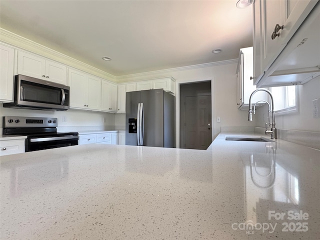 159 Hallman St, Cherryville, NC 28021 - kitchen featuring stainless steel appliances, white cabinetry, a sink, light stone counters, and crown molding