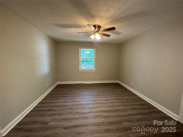 2703 34th Street Pl NE, Hickory, NC 28601 - spare room featuring baseboards, visible vents, a ceiling fan, and dark wood-style floors