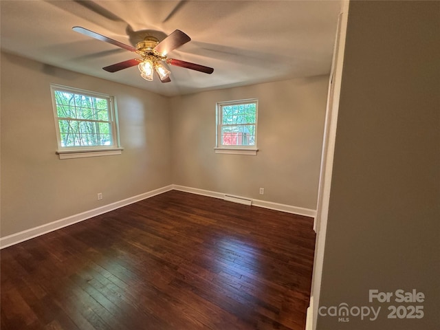 2703 34th Street Pl NE, Hickory, NC 28601 - empty room with baseboards, a ceiling fan, and dark wood-style floors