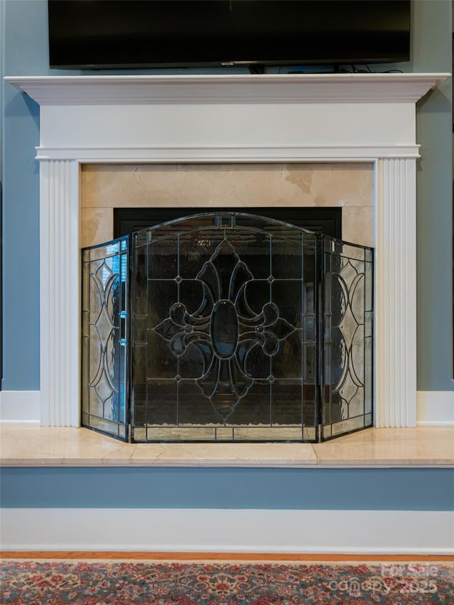 details featuring a high end fireplace