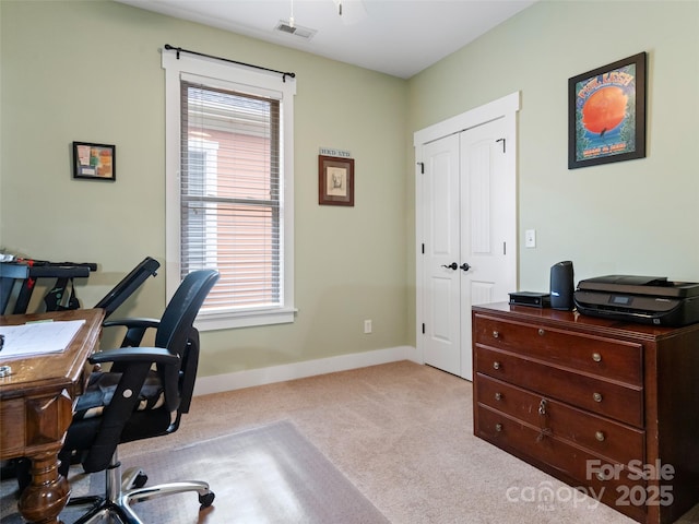 office with baseboards, carpet floors, visible vents, and a wealth of natural light