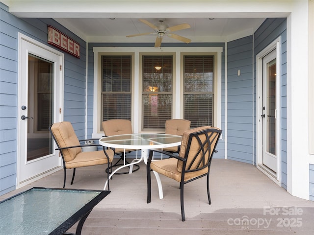 view of patio featuring a ceiling fan and outdoor dining area