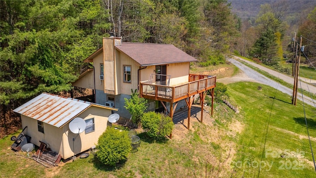 aerial view featuring a wooded view