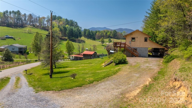 bird's eye view with a mountain view and a rural view