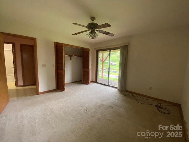 unfurnished bedroom with light colored carpet, baseboards, access to outside, and a closet