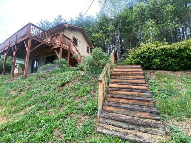 exterior space featuring a deck and stairs
