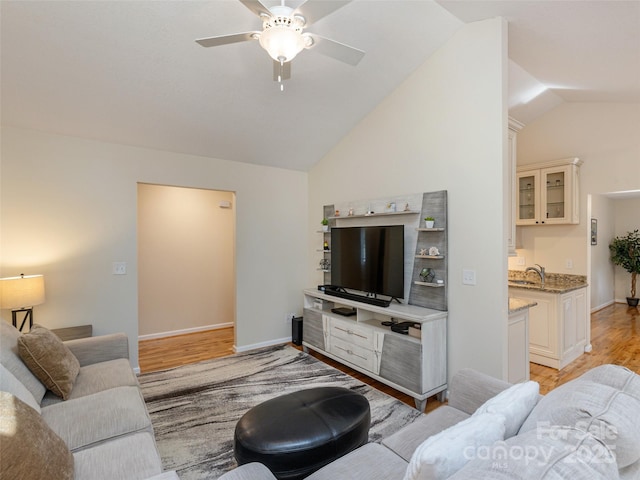 210 Allen Paul Dr, Hendersonville, NC 28791 - living area featuring vaulted ceiling, light wood finished floors, baseboards, and ceiling fan
