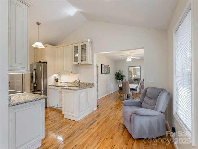 210 Allen Paul Dr, Hendersonville, NC 28791 - kitchen featuring open floor plan, stainless steel fridge, dishwasher, light wood finished floors, and lofted ceiling