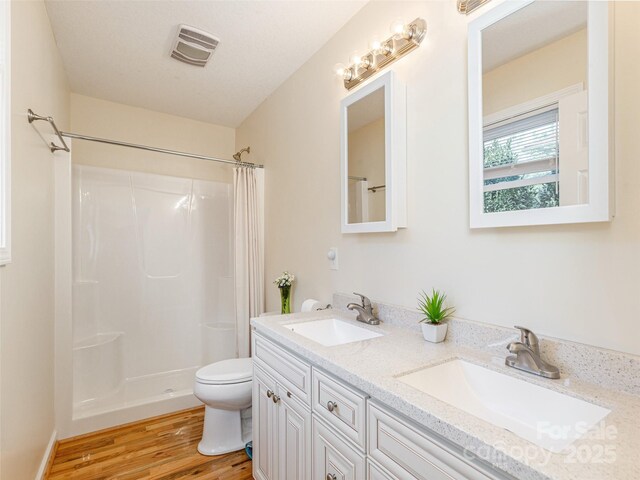 210 Allen Paul Dr, Hendersonville, NC 28791 - bathroom with wood finished floors, visible vents, a sink, and a shower with shower curtain