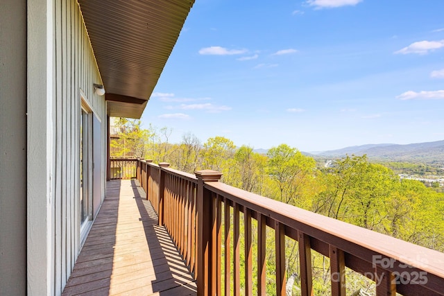 balcony with a mountain view and a wooded view