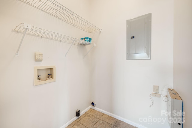 clothes washing area featuring electric panel, baseboards, washer hookup, laundry area, and light tile patterned floors