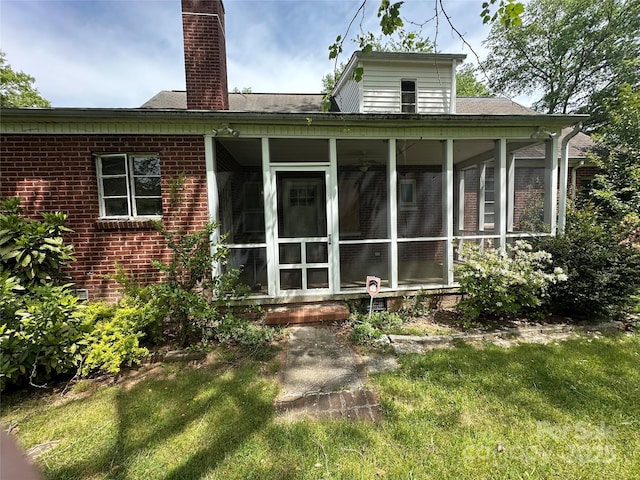 404 S Mulberry St, Cherryville, NC 28021 - rear view of house featuring a chimney, a sunroom, and brick siding