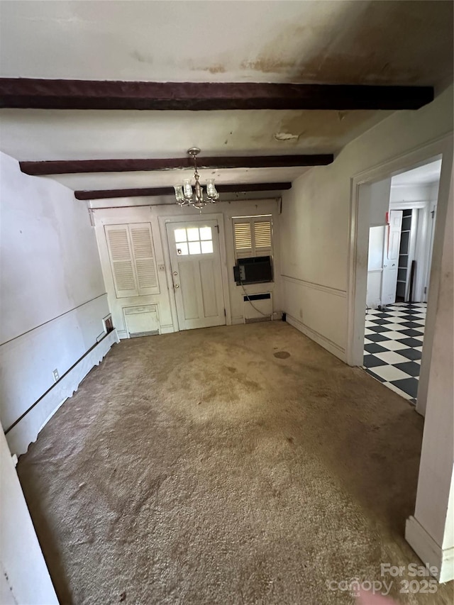 404 S Mulberry St, Cherryville, NC 28021 - unfurnished living room with beamed ceiling, light floors, and a notable chandelier