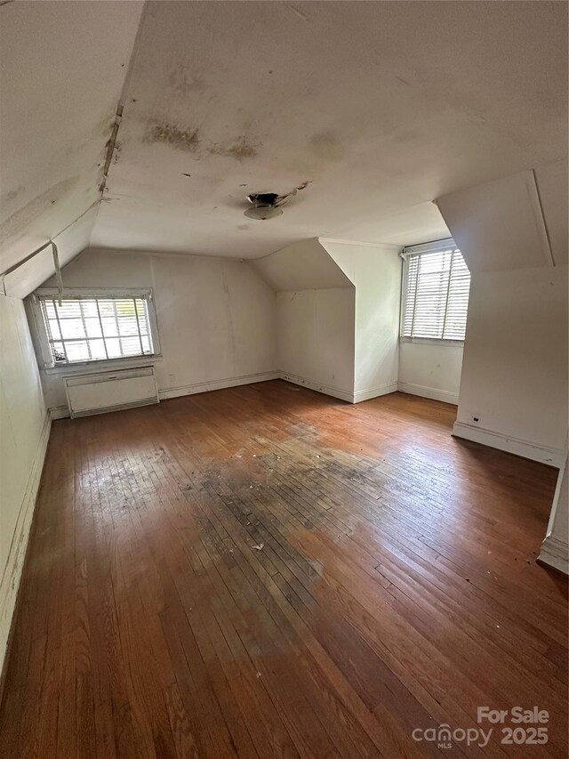 404 S Mulberry St, Cherryville, NC 28021 - bonus room with baseboards, vaulted ceiling, and hardwood / wood-style flooring