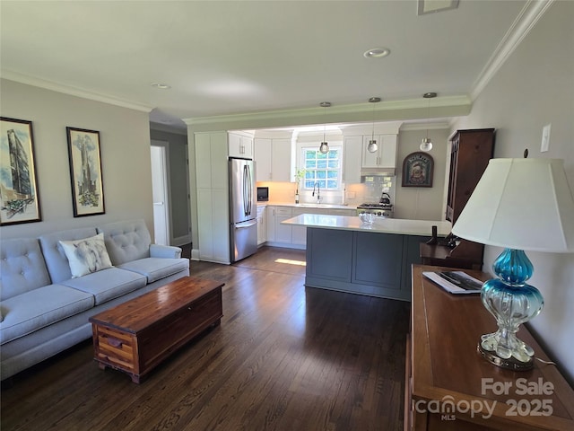 241 Wakefield Dr Unit C, Charlotte, NC 28209 - living room featuring ornamental molding, dark wood-style flooring, and recessed lighting