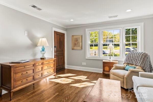 241 Wakefield Dr Unit C, Charlotte, NC 28209 - sitting room featuring dark wood-type flooring, visible vents, baseboards, and ornamental molding