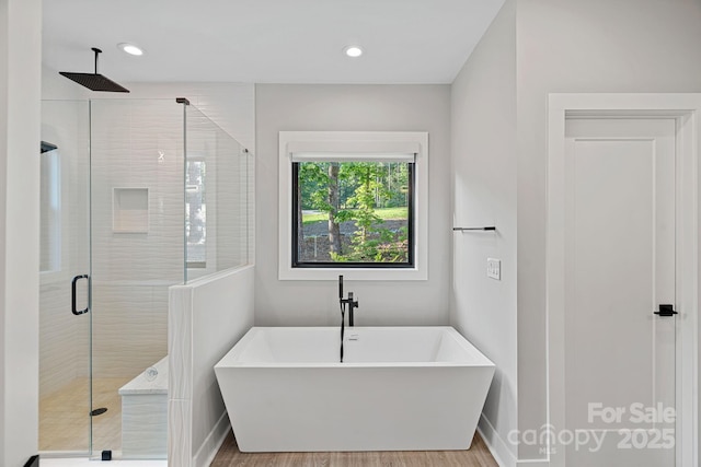 127 Holt Ln, Mooresville, NC 28117 - full bath with recessed lighting, baseboards, a freestanding bath, and a stall shower