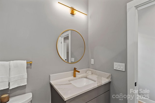 127 Holt Ln, Mooresville, NC 28117 - half bathroom featuring toilet and vanity