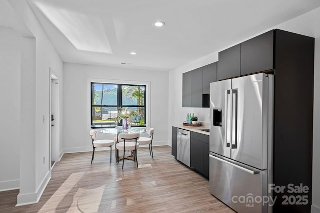 127 Holt Ln, Mooresville, NC 28117 - kitchen featuring stainless steel appliances, baseboards, recessed lighting, and light wood-style flooring