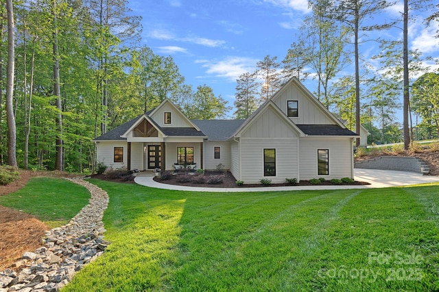 127 Holt Ln, Mooresville, NC 28117 - view of front of home with a front lawn, board and batten siding, roof with shingles, and french doors