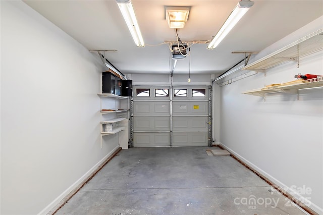 garage with baseboards and a garage door opener