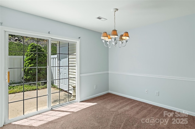 carpeted empty room featuring visible vents, baseboards, and a notable chandelier