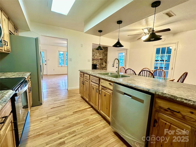 5381 State Highway 197 S Unit 3, Burnsville, NC 28714 - kitchen featuring light wood-type flooring, electric stove, stainless steel dishwasher, and a sink