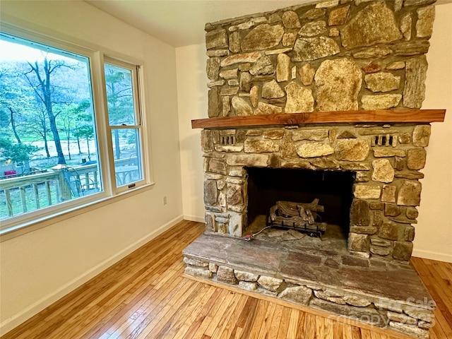 5381 State Highway 197 S Unit 3, Burnsville, NC 28714 - interior details featuring baseboards, wood finished floors, and a stone fireplace