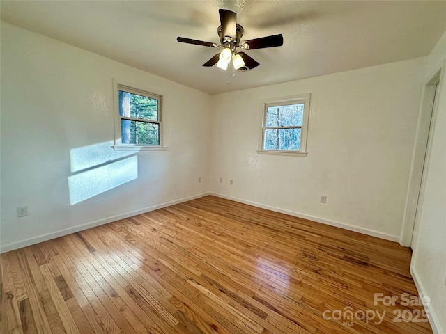 5381 State Highway 197 S Unit 3, Burnsville, NC 28714 - empty room with baseboards, a wealth of natural light, and light wood-type flooring