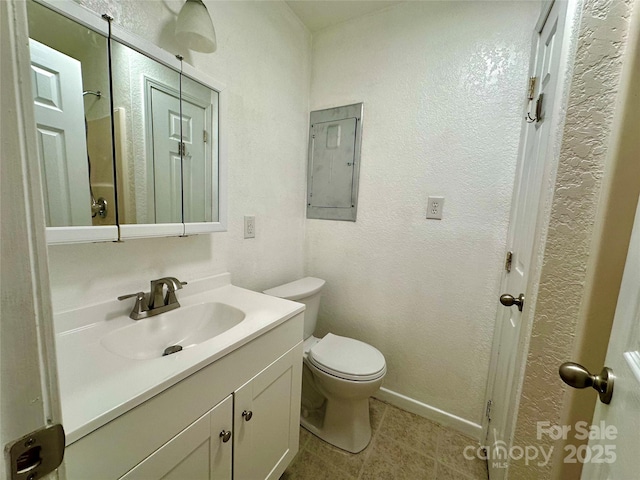 5381 State Highway 197 S Unit 3, Burnsville, NC 28714 - bathroom featuring electric panel, toilet, baseboards, tile patterned flooring, and vanity